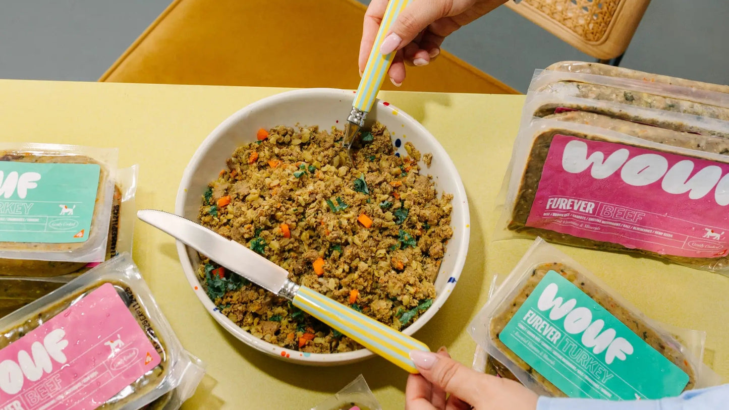 Person eating from a bowl of food with WOW! brand packages on a table.